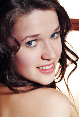 Blueeyed brunette is a fresh young baby doll