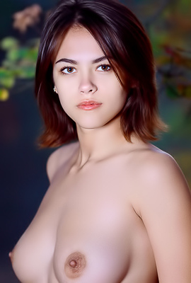 Dzhili Offering An Uninhibited Display Of Her Perky Breasts