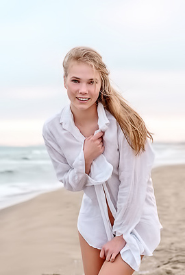 Luise Entices With A Beach Striptease Revealing Perky Nipples And Grabbing Her Curves