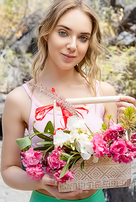 Oxana Chic Shows Off In Crop Top Gathering Flowers, Teasing View Under Shorts