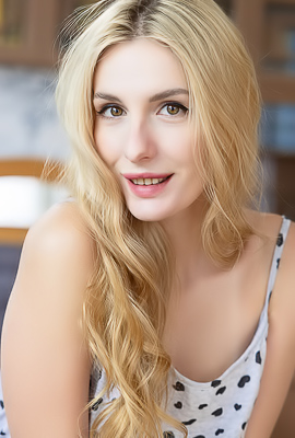 Lillie Commanding in Blue Lace On Green Chair Over Wooden Floors